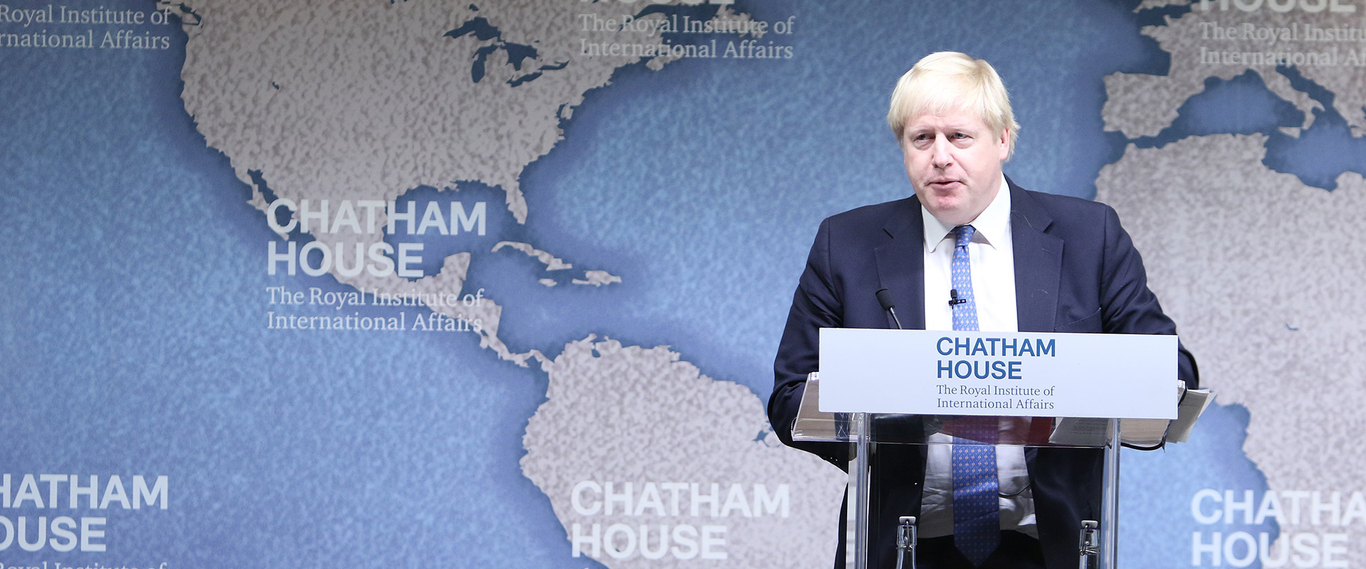 Boris Johnson speaking at lecturn